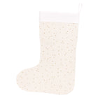 Die KraftKids Weihnachtssocke Musselin goldene Punkte auf Weiß ist eine cremefarbene Socke mit weißem Bund und goldenen Punkten - perfekt als charmante Weihnachtsdekoration, präsentiert vor weißem Hintergrund.